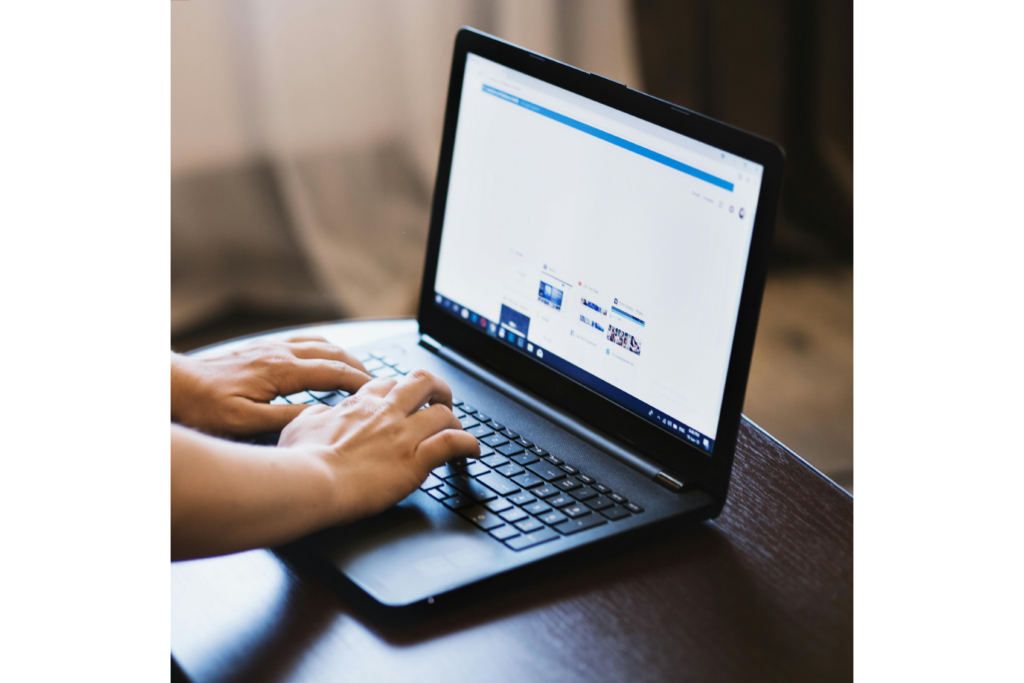 typing at a laptop